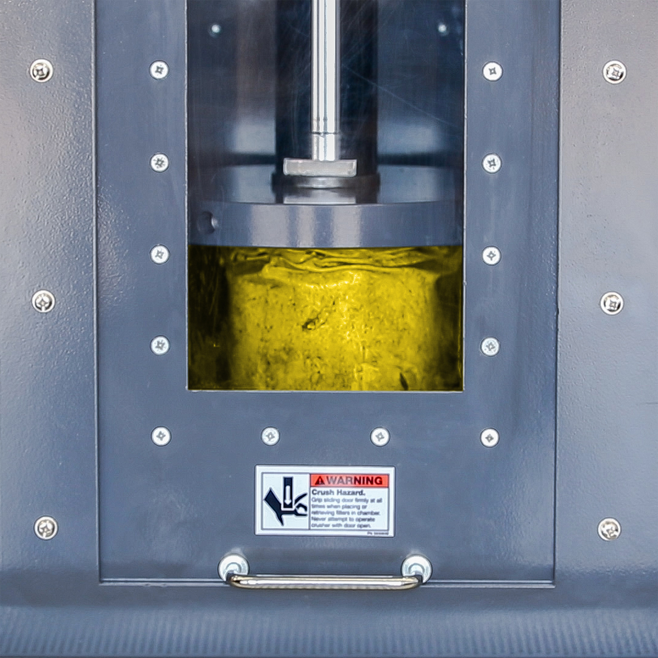 Automatic Oil Filter Crushing with Built-In Safety Features